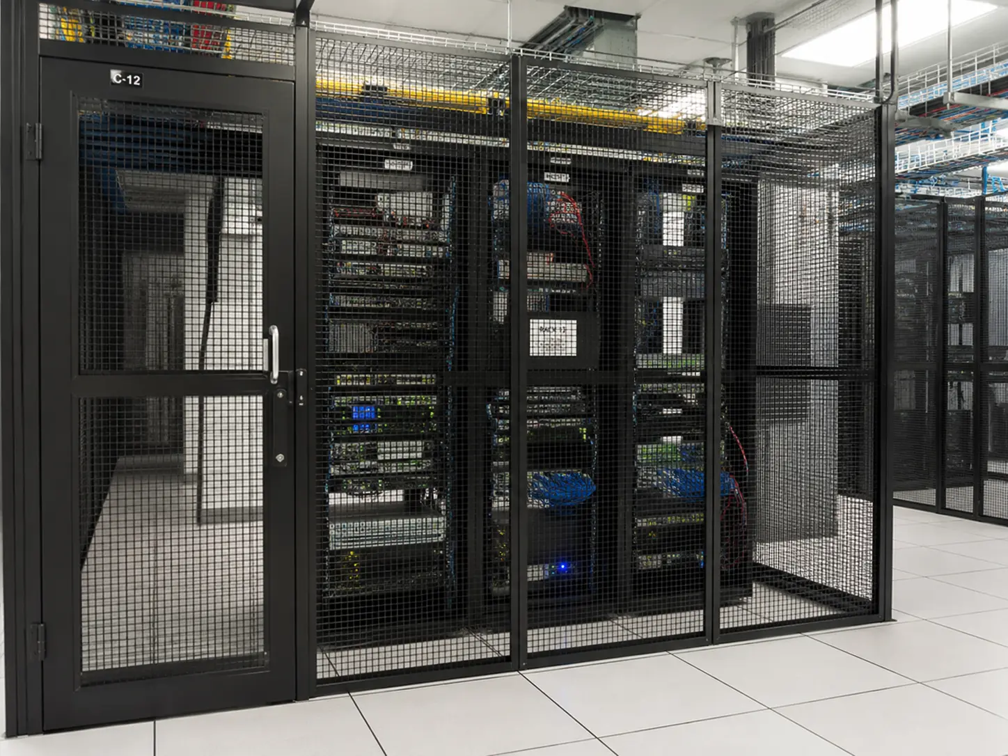 A locked equipment cage in the data center where VoIP Country runs its hosted phone platform